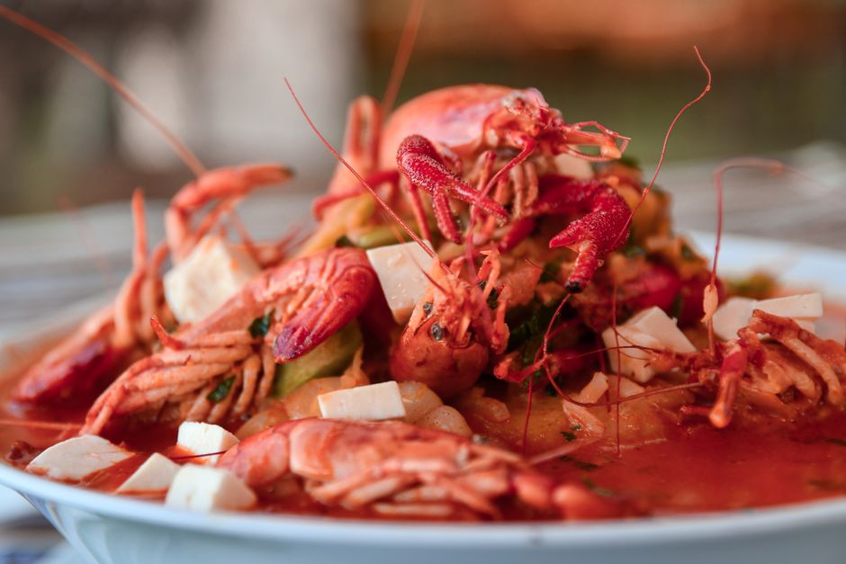 Delicious lobster served with cubes of cheese in a rich, flavorful sauce.